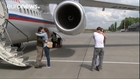Russians jailed in Ukraine return to Moscow in Savchenko exchange deal