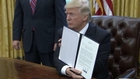 Trump signs order withdrawing U.S. from TPP deal