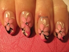 Nail art: Hot pink and black french with flower and rhinestone