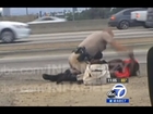 Cop Brutally Punches Woman On The Highway (Warning: Graphic Video)