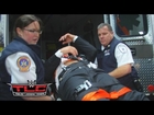 Triple H is loaded into an ambulance after being attacked by Roman Reigns: December 13, 2015