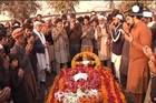 Pakistan begins painful process of burying children massacred by the Taliban