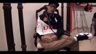 Dead Puerto Rican Man propped up in a chair wearing Jordans