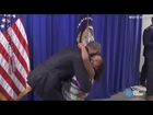 Obama greets 'Little Miss Flint' with massive bear hug